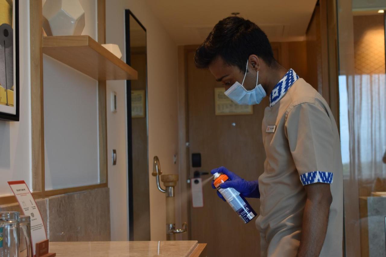 Welcomhotel By Itc Hotels, Racecourse, Coimbatore Exterior foto A hotel employee disinfecting a guest room